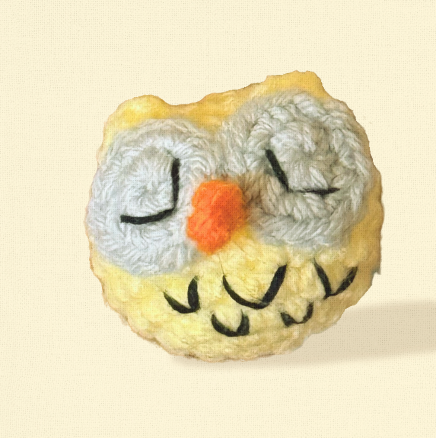 Yolk the Owl, a 2-inch handmade catnip toy from Feline Grove’s Chunkle Puff collection, shown alone on a neutral background. Round woven owl form highlights artisanal craftsmanship and luxury design.