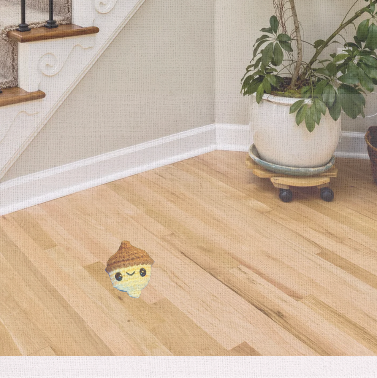 Lifestyle photo of Augie the Acorn, a handmade Chunkle Puff catnip toy by Feline Grove. Displayed in a refined home setting with linen backdrop, styled for boutique elegance.