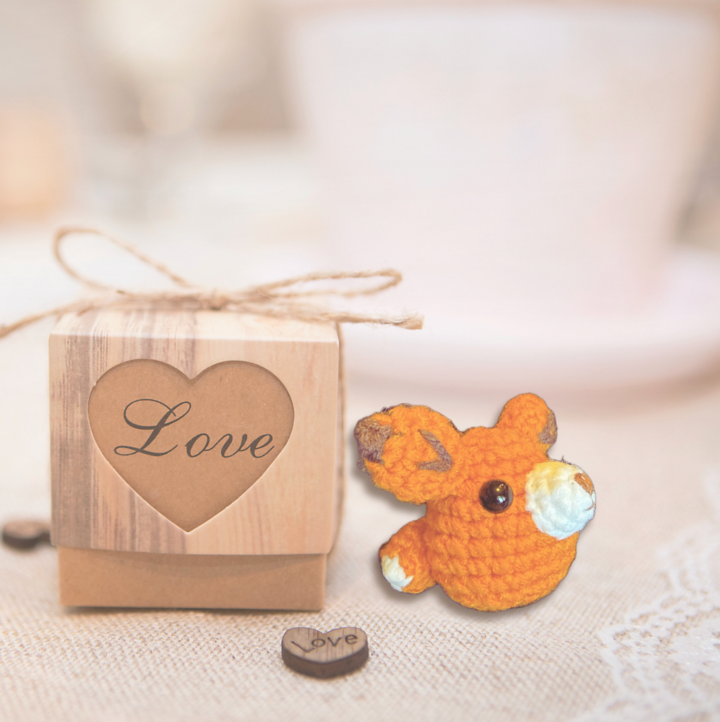 TJ the Fox, a handmade Chunkle Puff catnip toy by Feline Grove, shown with a boutique gift box. The woven fox toy is presented as a luxury collectible piece designed for refined gifting and feline play.