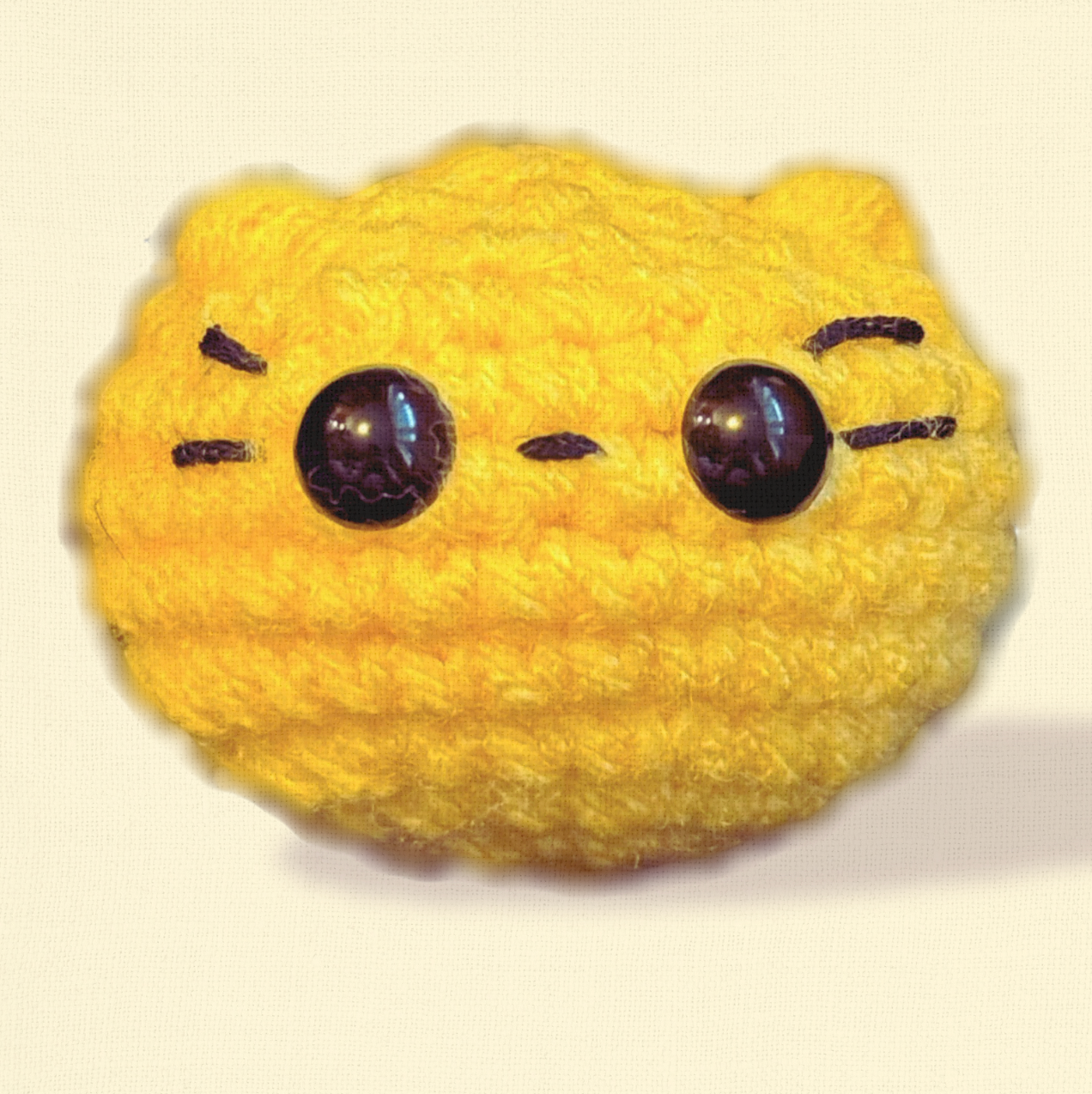 Pippa the Chonk, a handmade weighted Chunkle Chunk catnip toy by Feline Grove, shown alone against a neutral background with boutique lighting to highlight her rounded plush form