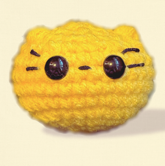 Pippa the Chonk, a handmade weighted Chunkle Chunk catnip toy by Feline Grove, shown alone against a neutral background with boutique lighting to highlight her rounded plush form