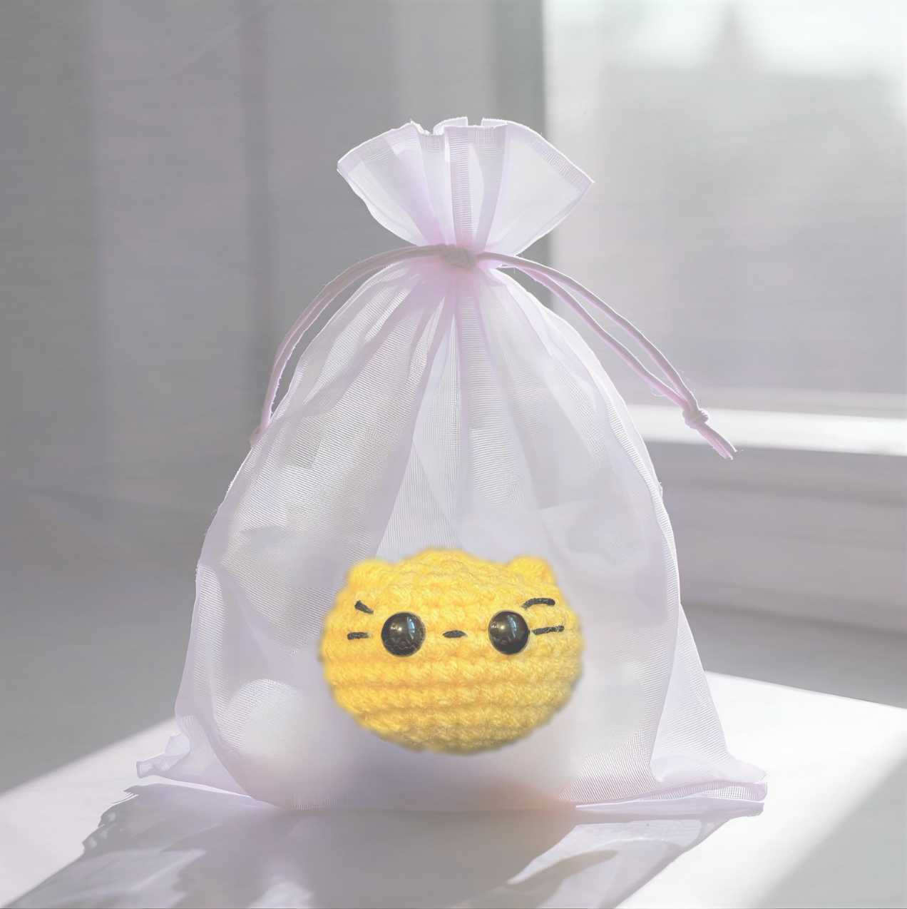 Pippa the Chonk, a handmade weighted Chunkle Chunk catnip toy by Feline Grove, shown with a boutique gift bag as a collectible, luxury cat toy for gifting