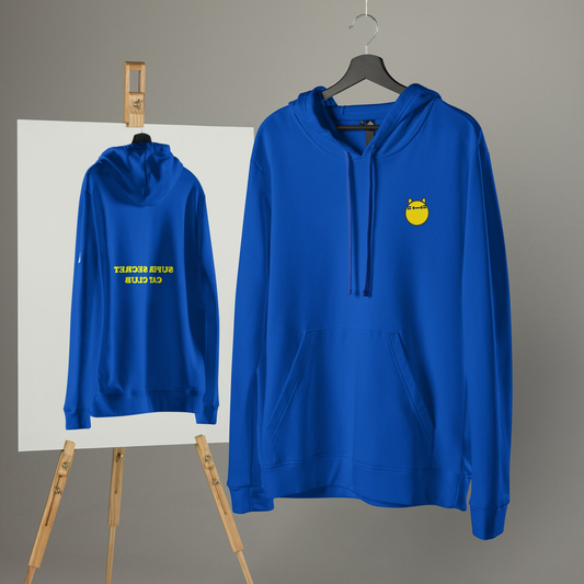 A vibrant blue hoodie featuring a minimalist yellow cat design on the front and bold yellow text reading "Super Secret Cat Club" on the back. The hoodie is displayed on a hanger and reflected in a mirror, highlighting both the front and back designs. Perfect for stylish cat lovers.