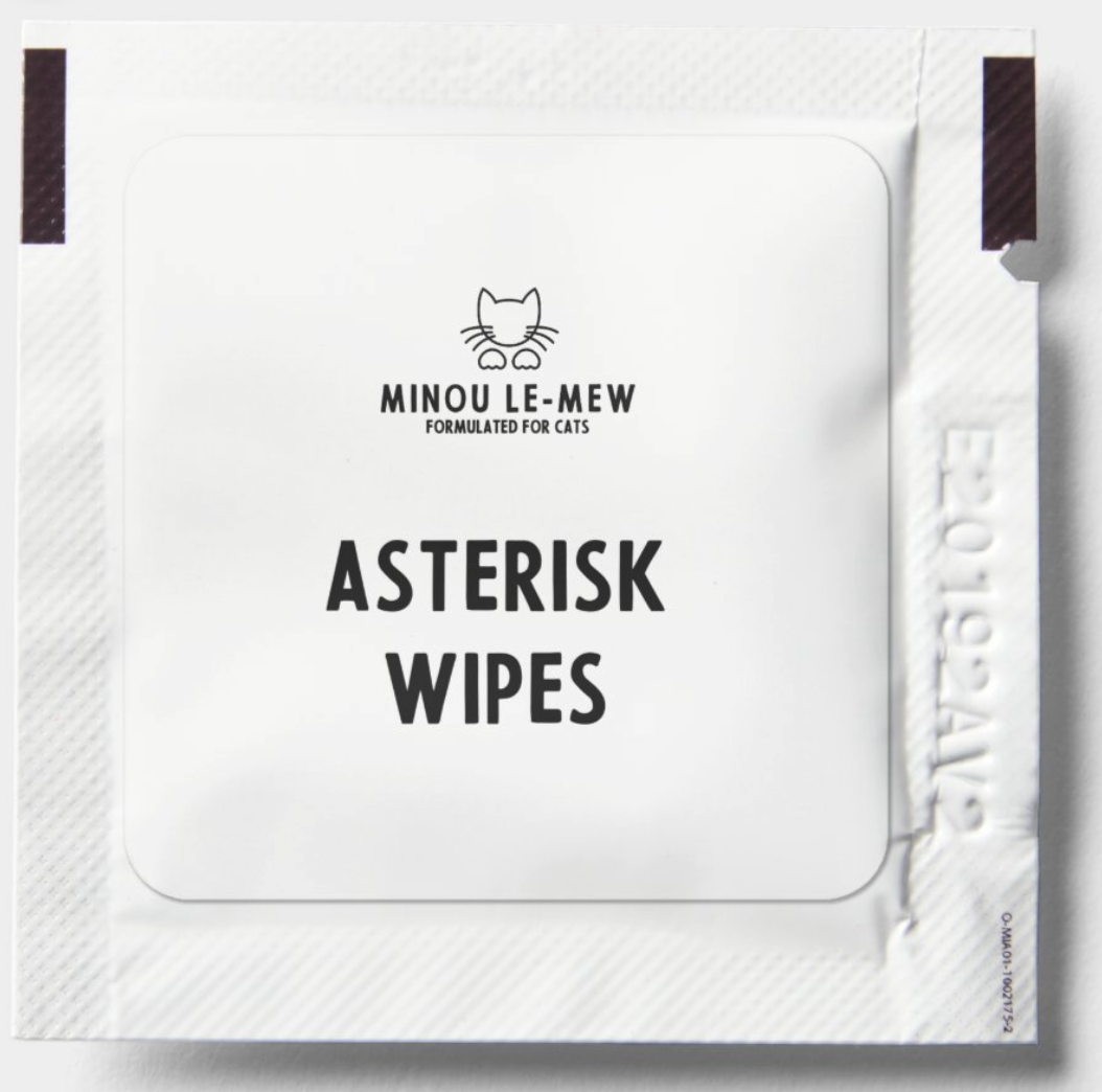 A close-up of an individual Asterisk Wipes packet by Minou Le-Mew, featuring a minimalist design with a cat logo and the tagline "Formulated for Cats." The clean, white packaging highlights the premium quality and gentle care these wipes provide for feline hygiene.