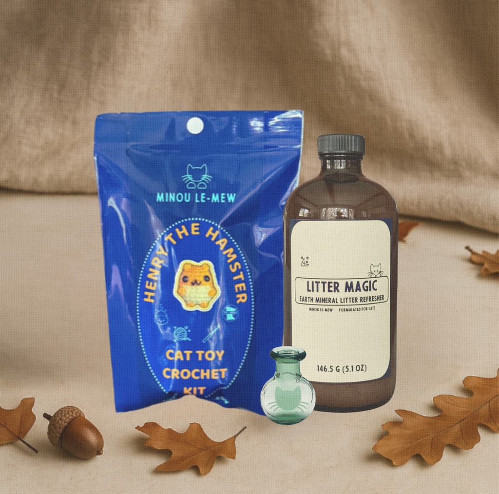 A curated bundle with Litter Magic, a Whisker Vase, and the Cat Toy Crochet Kit by Minou Le-Mew, styled together as a boutique gift set.