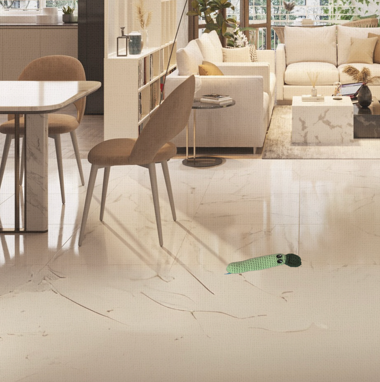 Lifestyle photo of Noodle the Inchworm, a handmade Chunkle Puff catnip toy by Minou Le-Mew. Displayed in a refined interior with linen backdrop, styled for boutique elegance.