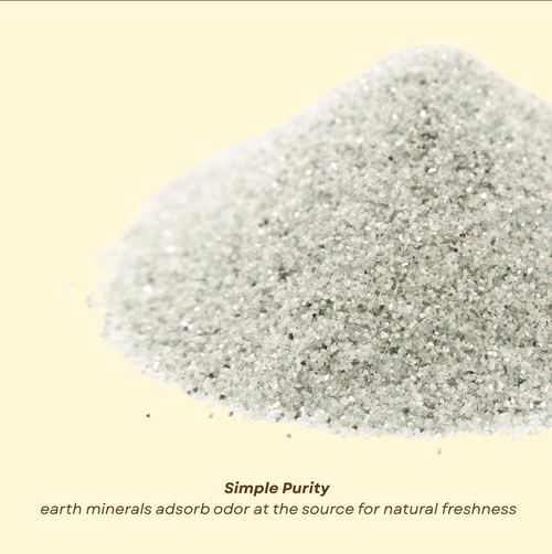 Finely milled gray mineral powder from Litter Magic by Minou Le-Mew, photographed in detail to highlight its natural, fragrance-free texture for elegant odor control.