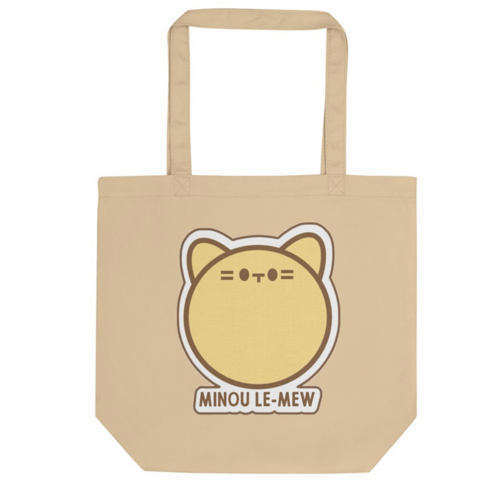 Beige tote bag with a cat-themed design and 'MINOU LE-MEW' text on a white background